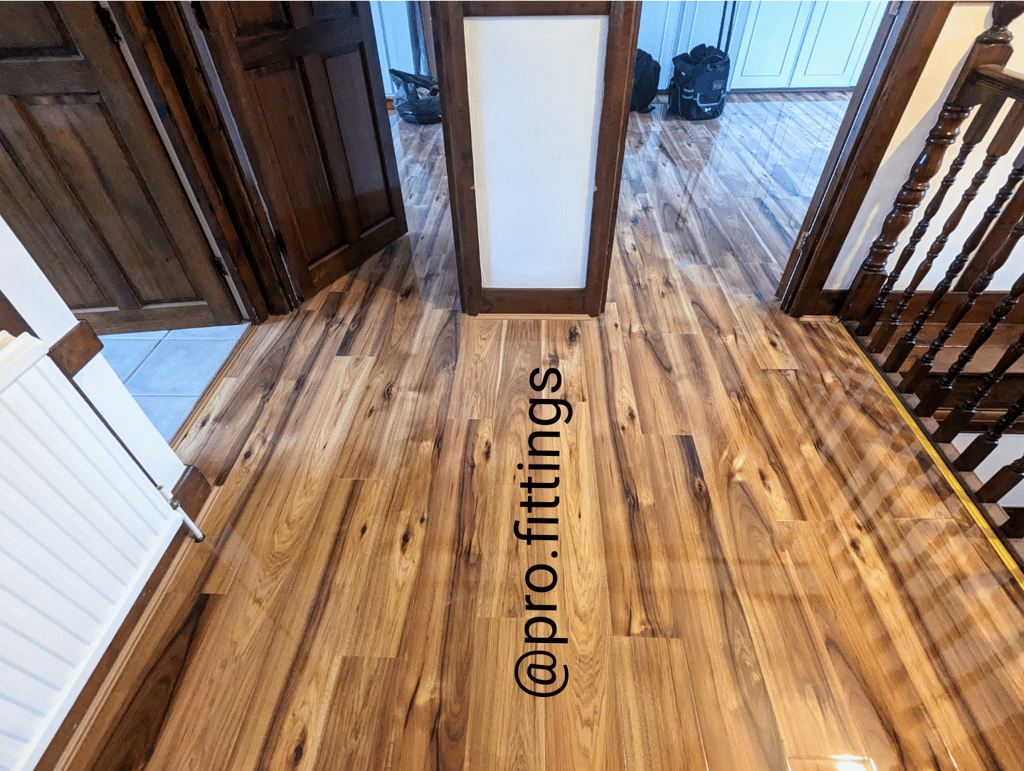 Gloss laminate flooring fitted in Stratford by Pro Fittings Ltd