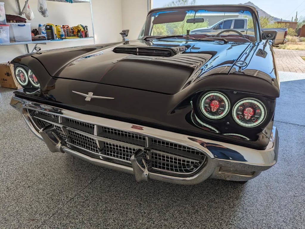 A customized Ford Thunderbird with modified lights for stylizing.