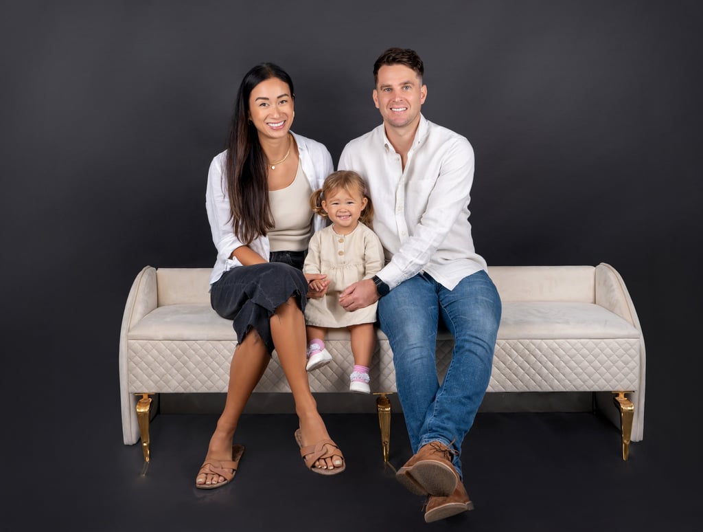 Tender family embrace captured in a timeless portrait, celebrating love and togetherness.