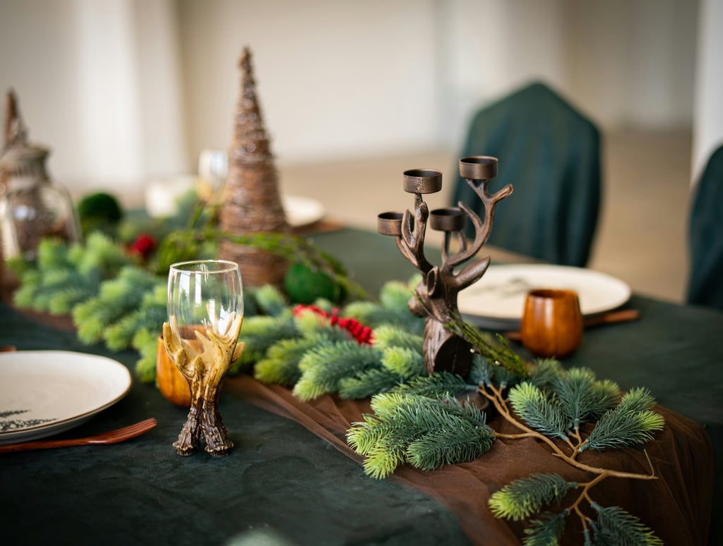 a table with a table setting with a candle and candles