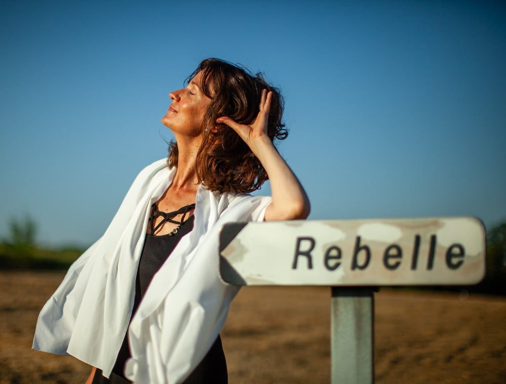 a rebel woman in a white robe