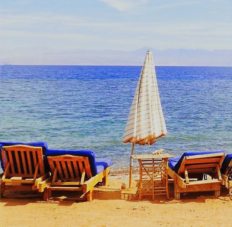 Relaxing in front of the sea on our chaise lounge