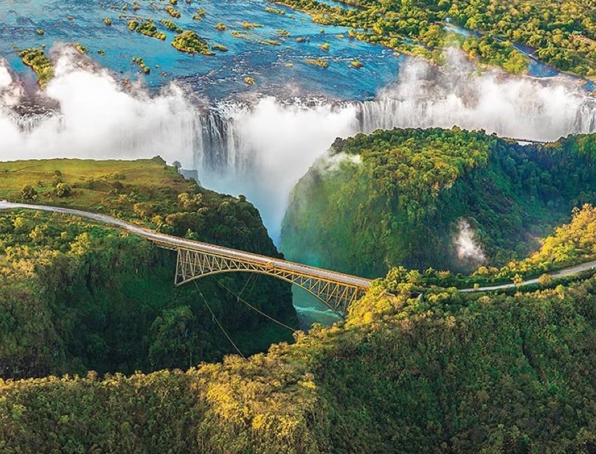 Rovos Rail luxury train in South Africa passing through scenic landscapes.