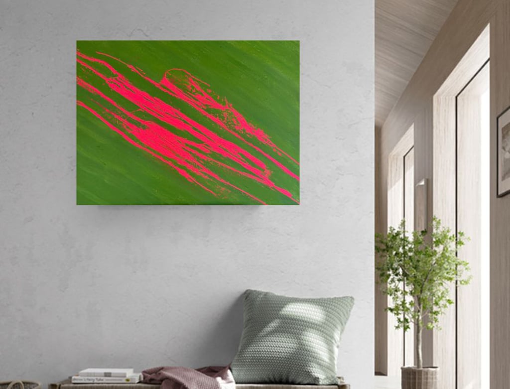 Neon pink stripes on moss green canvas on a boho wall