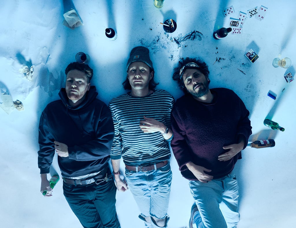 Glider band members lying on a dirty white paper.