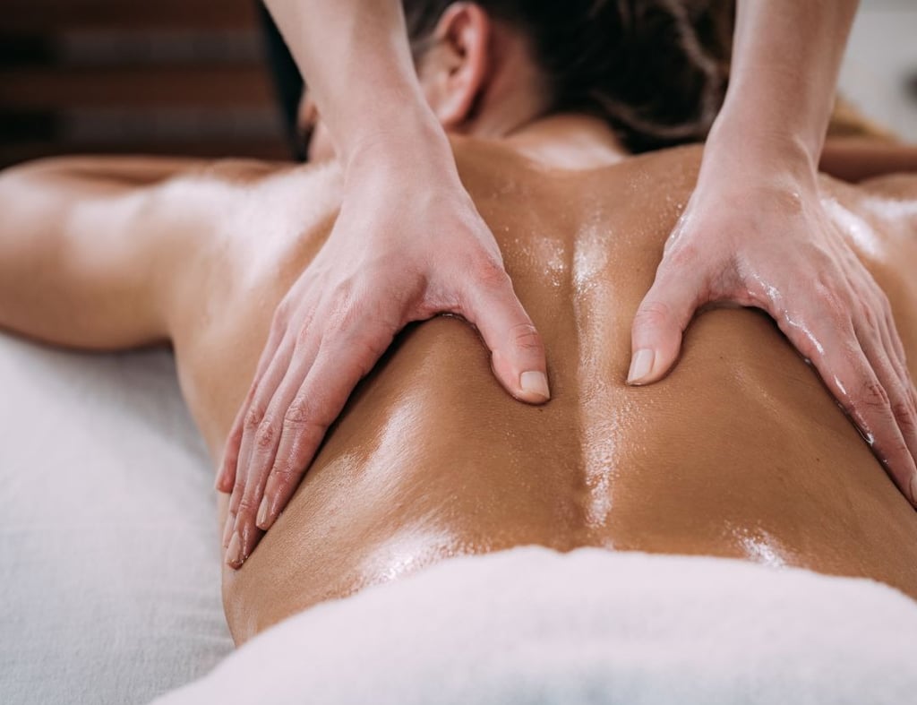 a woman getting a massage at a spa