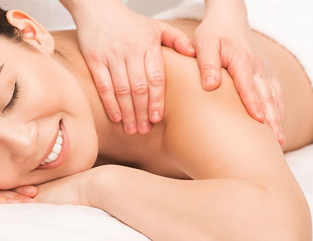 a woman is getting a massage at a massager