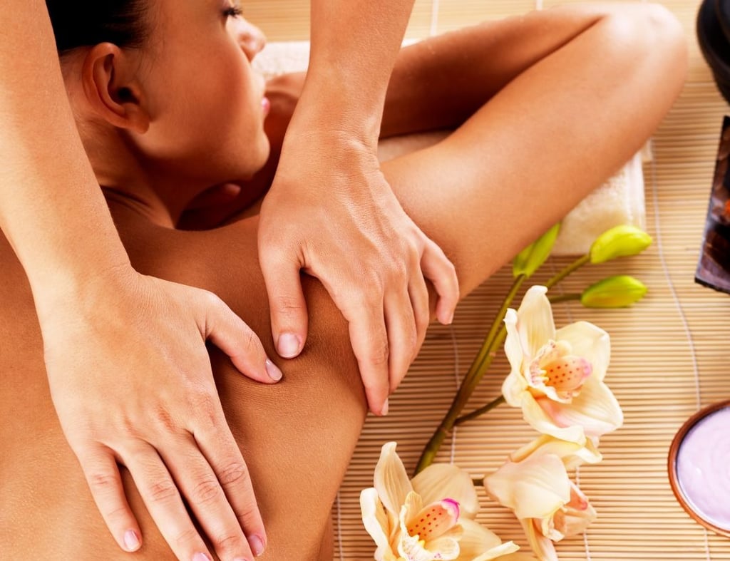 a woman getting a massage at a spa