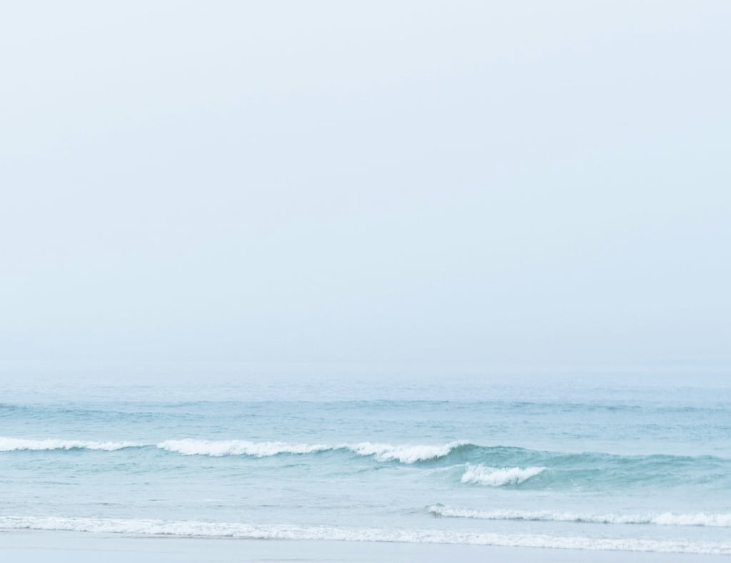 Peaceful ocean horizon with gentle blue waves — online stress relief and energy reset classes with Lionel Gougne