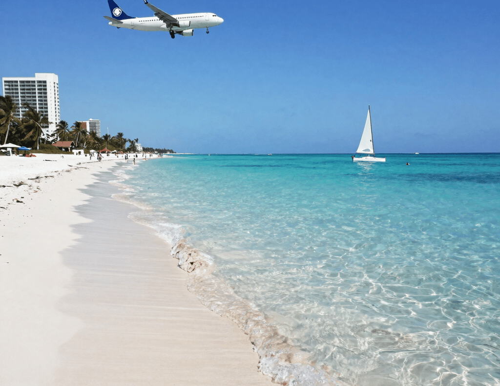 A vibrant beach scene with turquoise Caribbean waters and palm trees swaying under a clear blue sky.