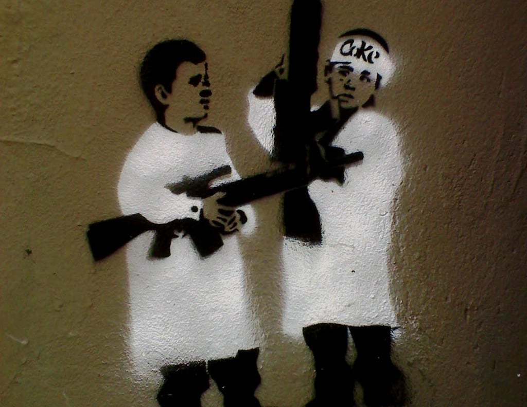 Boys being taught to wage war