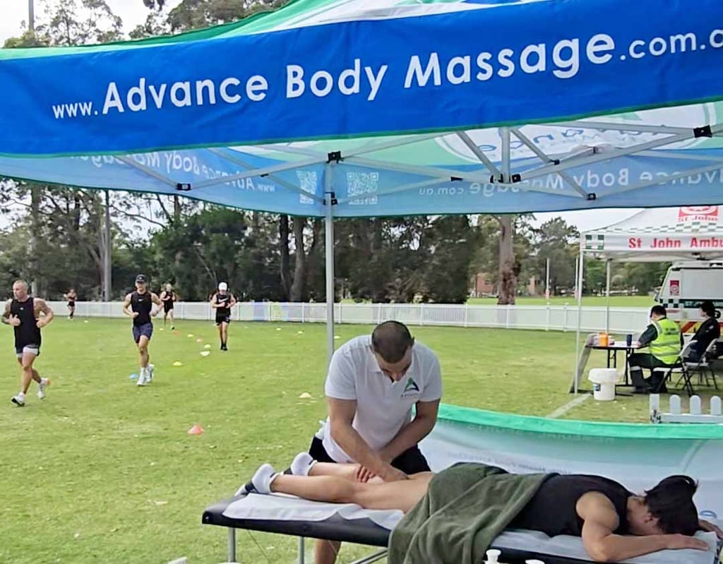 female having a leg sports massage at Wollongong HYROX event