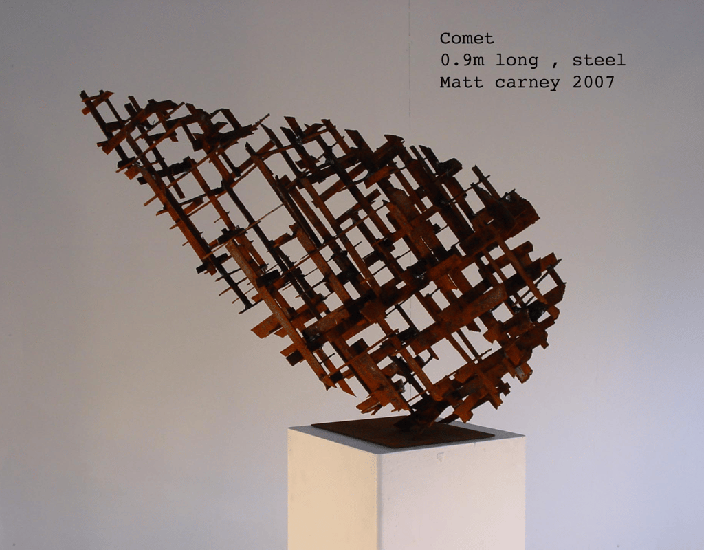 a rusted steel cross-hatched comet shaped sculpture