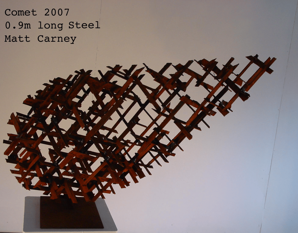 a rusted steel cross-hatched comet shaped sculpture