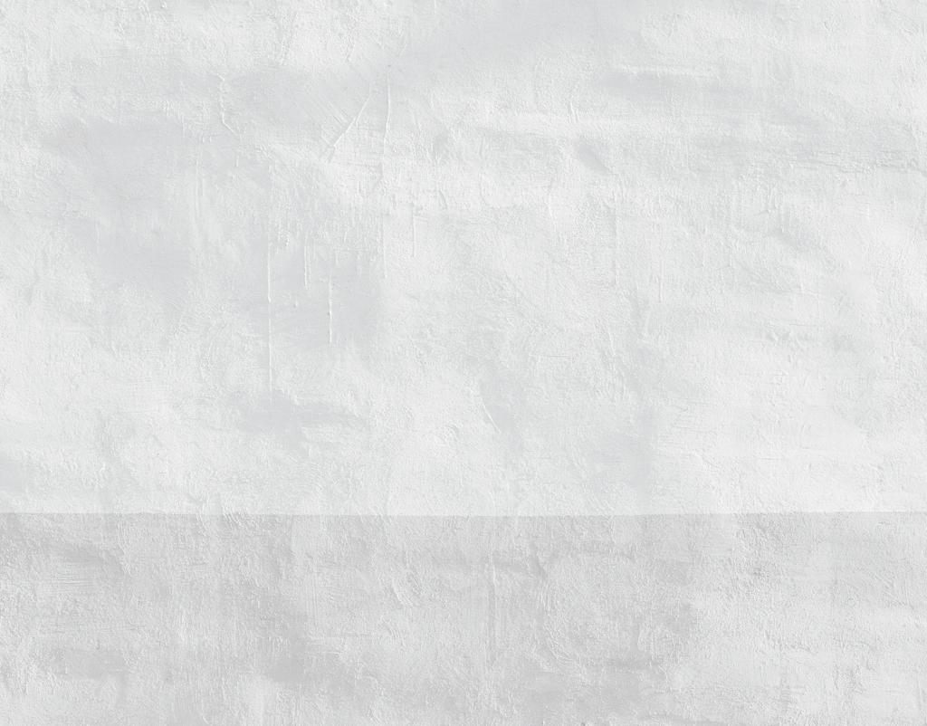 Minimalist white textured plaster wall with a subtle grey horizontal band at the base.