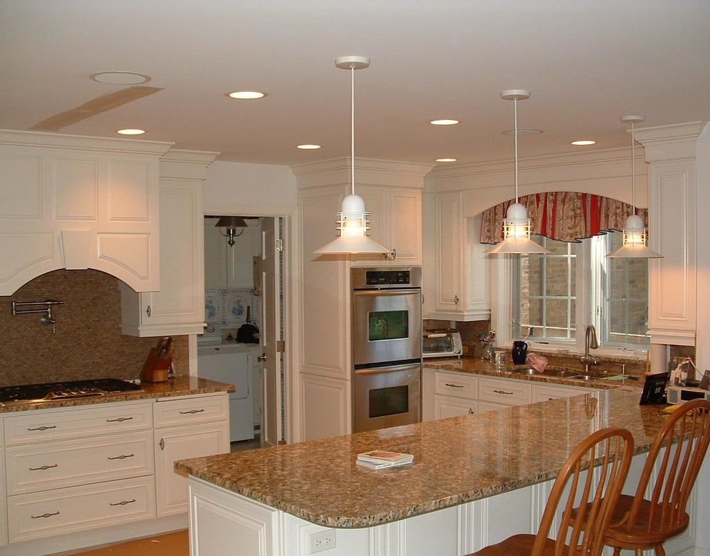 Custom white kitchen cabinet installation and design