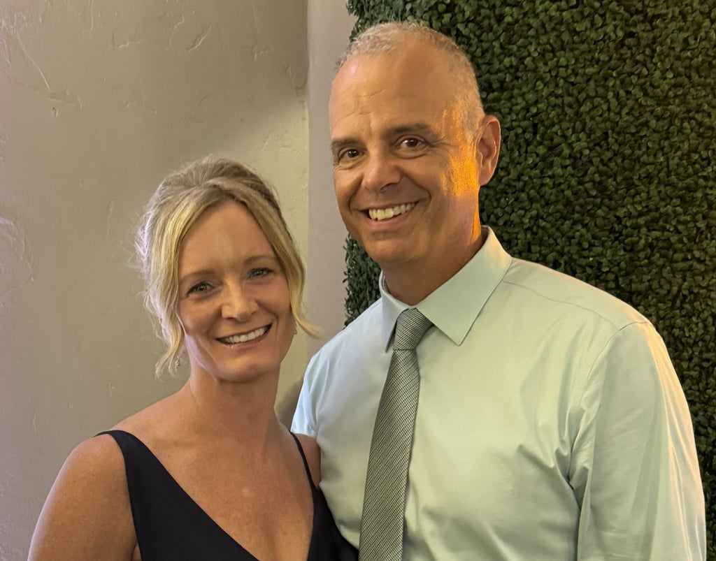 Christine and her husband smiling at a wedding in Scottsdale, Arizona after a 5-day Lumineux whiteni