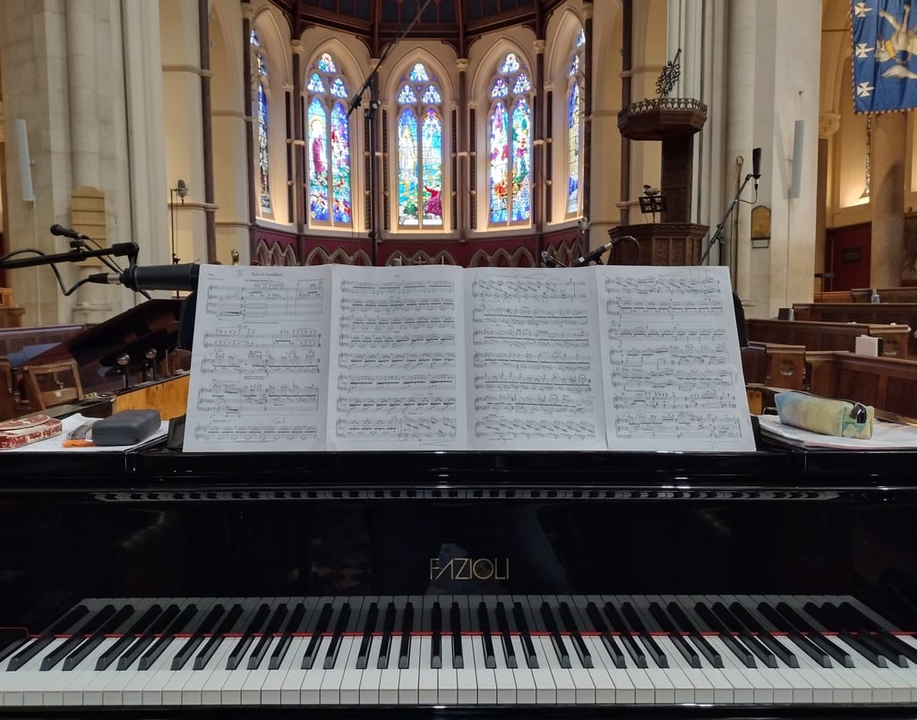 Photo of a grand piano in a chapel