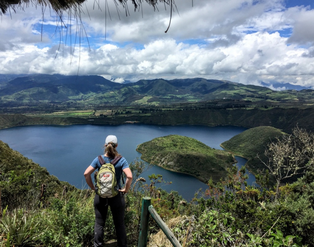 hiker overlooking Cuicocha lake