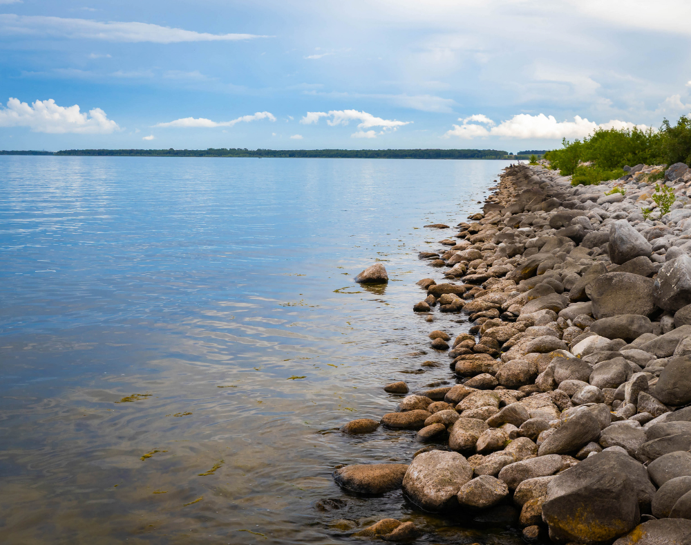 Riprap shoreline restoration and sand beach installation.