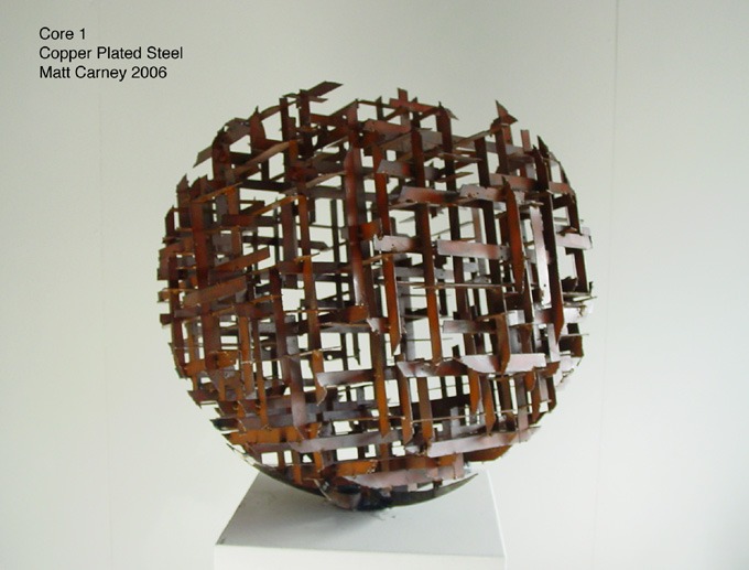 a copper plated steel cross-hatched sphere shaped sculpture