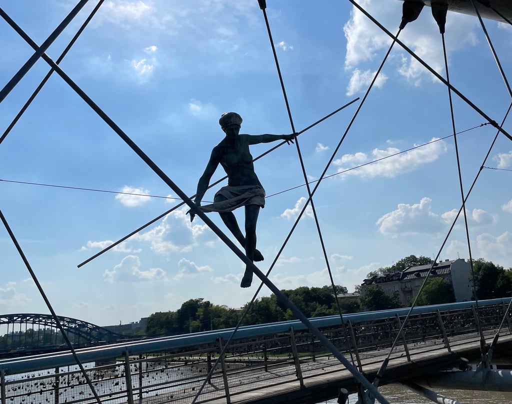 a man is doing tricks on a bridge