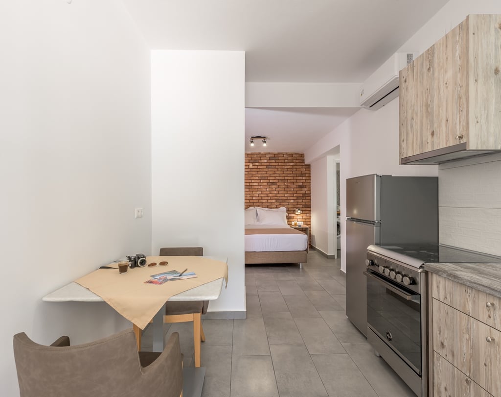 a kitchen with a table and chairs and a table