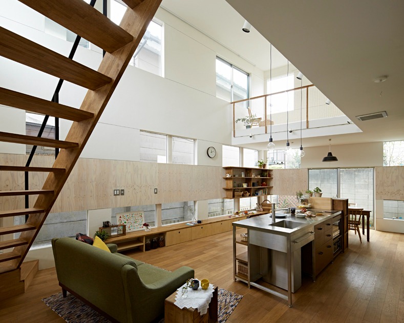 Learn about us: modern home kitchen with stainless steel island, integrated sink.