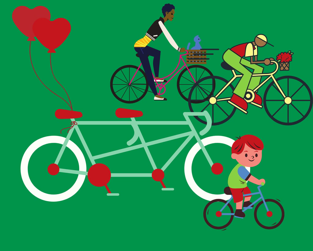a man and woman riding bicycles with balloons