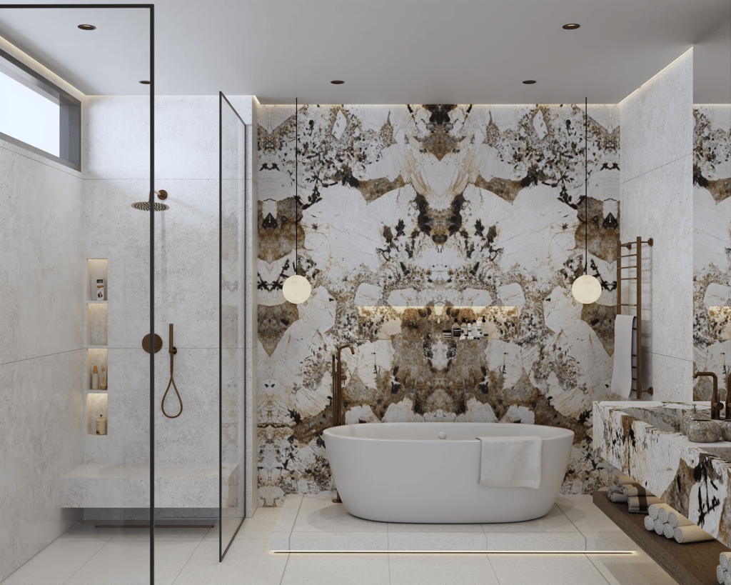 Luxurious bathroom with a white freestanding bathtub against a Patagonia Marble wall.