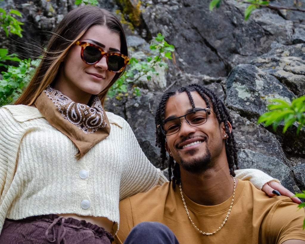 Young Man and woman standing outside, smiling, and wearing fashion eyewear