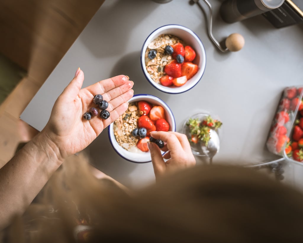 photo of vibrant breakfast fruit bowl being prepared 