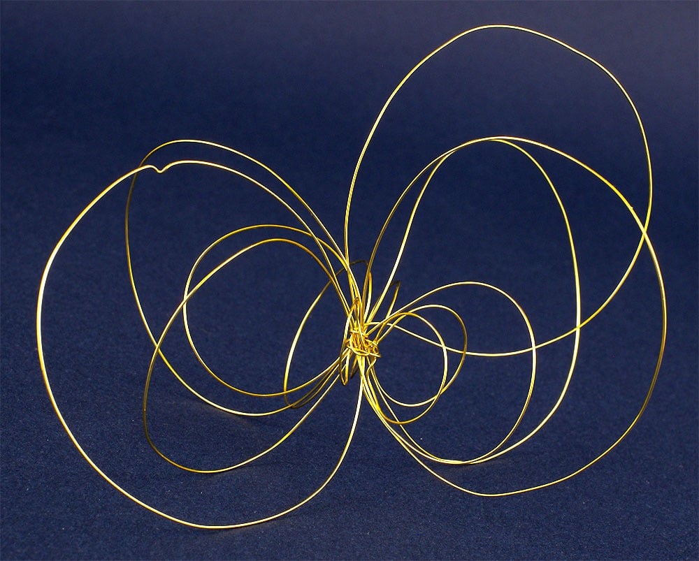 Mabstract etal wire sculpture representing wings