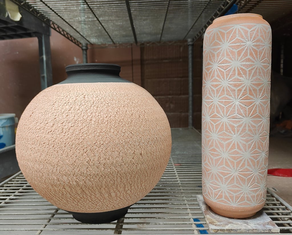 wheel-thrown moon jar and cylinder with contrasting patterns and colors, ready for high fire