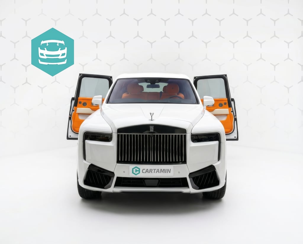 White Rolls-Royce Cullinan luxury SUV with open suicide doors and a bright orange leather interior.