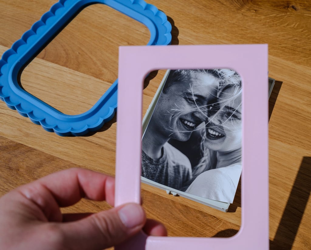     KOIJOY 3D printed frames displayed on a desk in a minimal interior setting