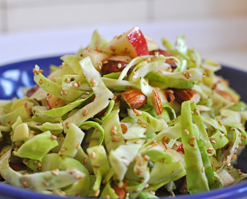 Cabbage juicy salad with apples, sesam and almonds