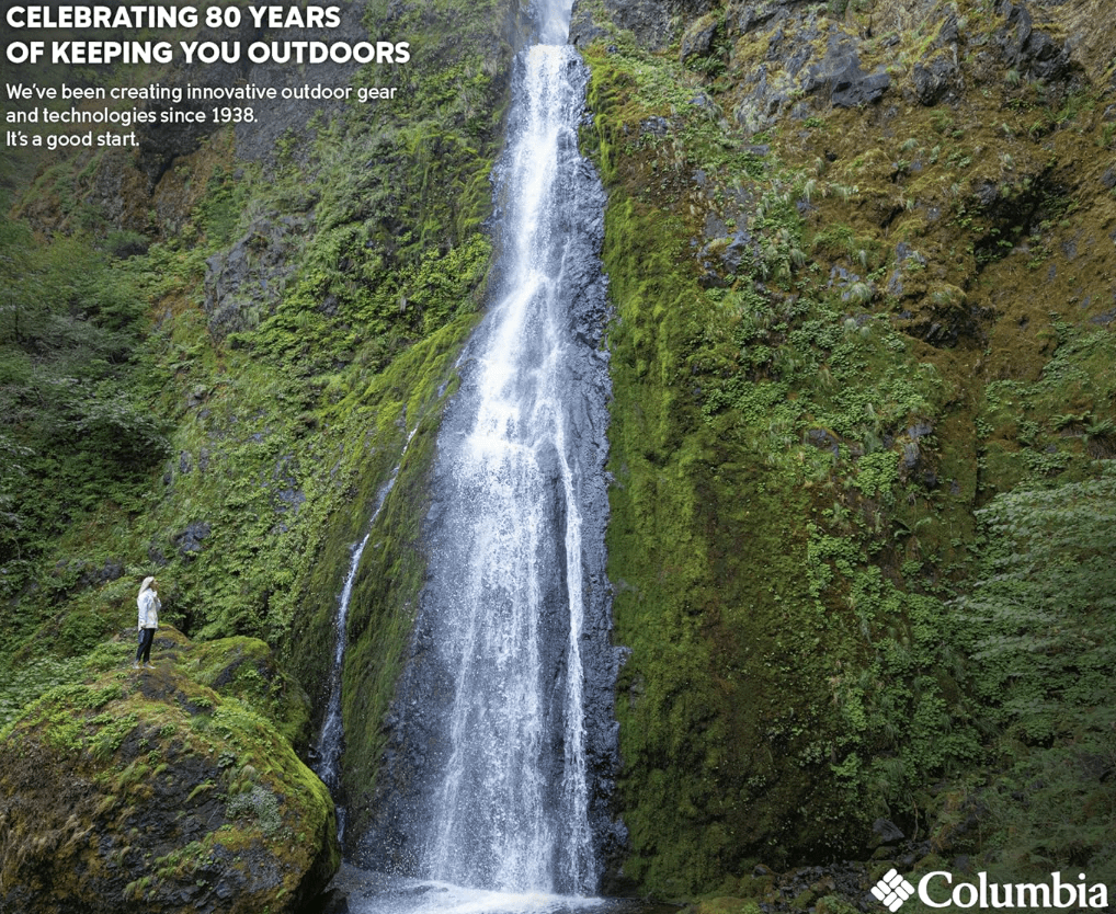 Women wearing a Columbia Switchback jacket by waterfall