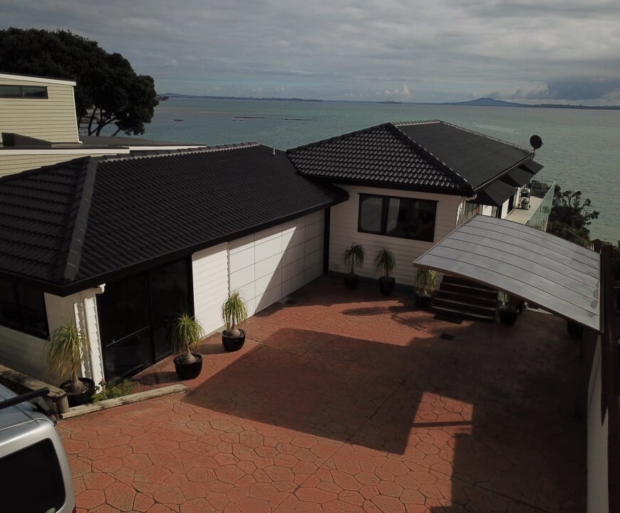 New roof and reclad water front home