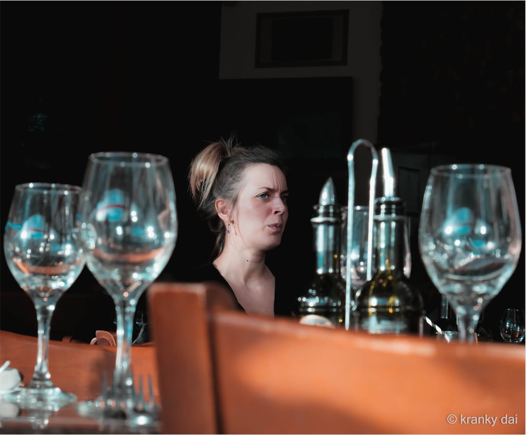 Young lady lost in her thoughts whilst in a restaurant 