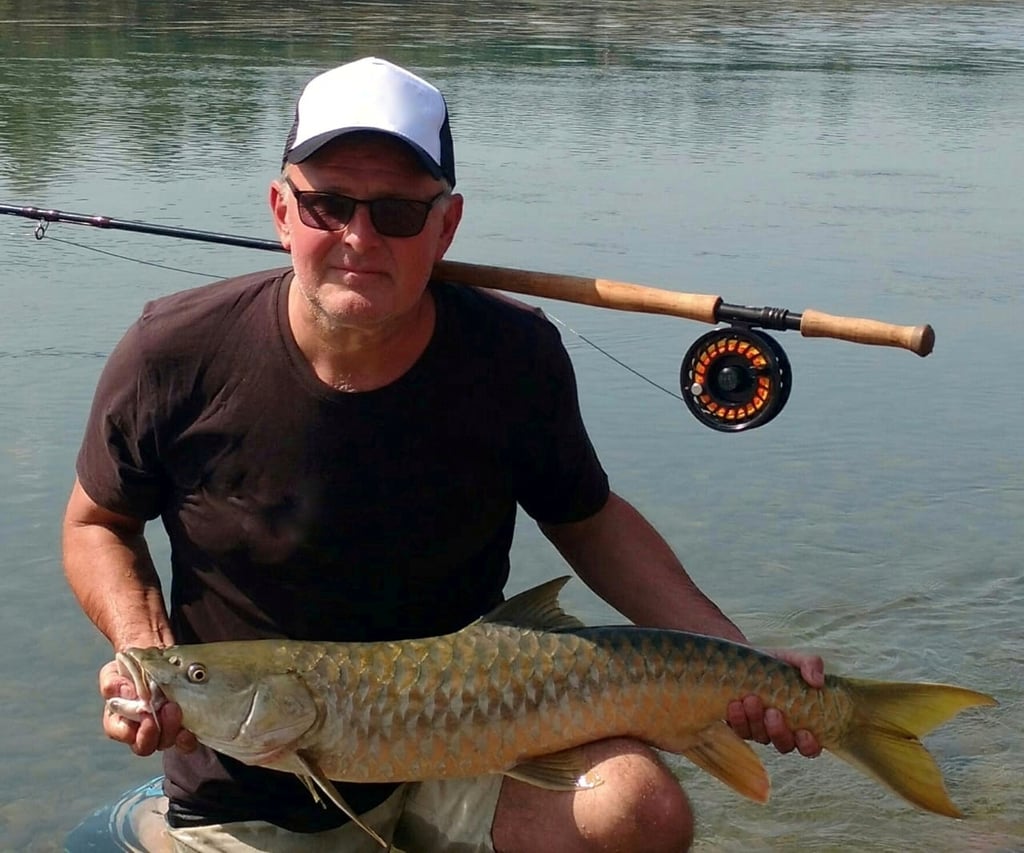Catching Himalayan Golden Mahseer on the fly.