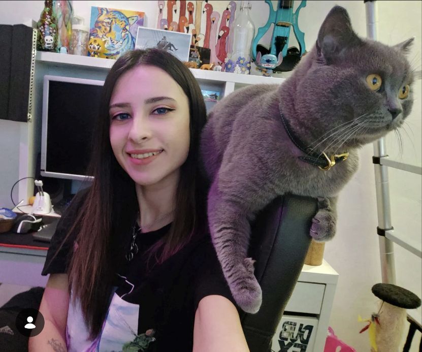 Raly Yoncheva, creator of Pawsonalities, with her British Shorthair cat