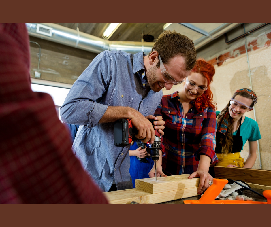 people working with wood in the makerspace