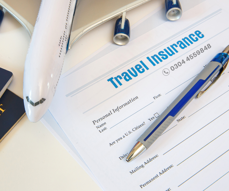 a pen on travel insurance paper