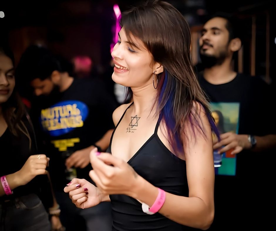 a woman with a tattoo on her chest and a tattoo on her chest