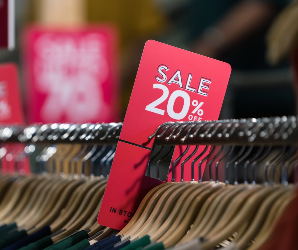 Sale sign on a rack of clothing to symbolise AI in retail