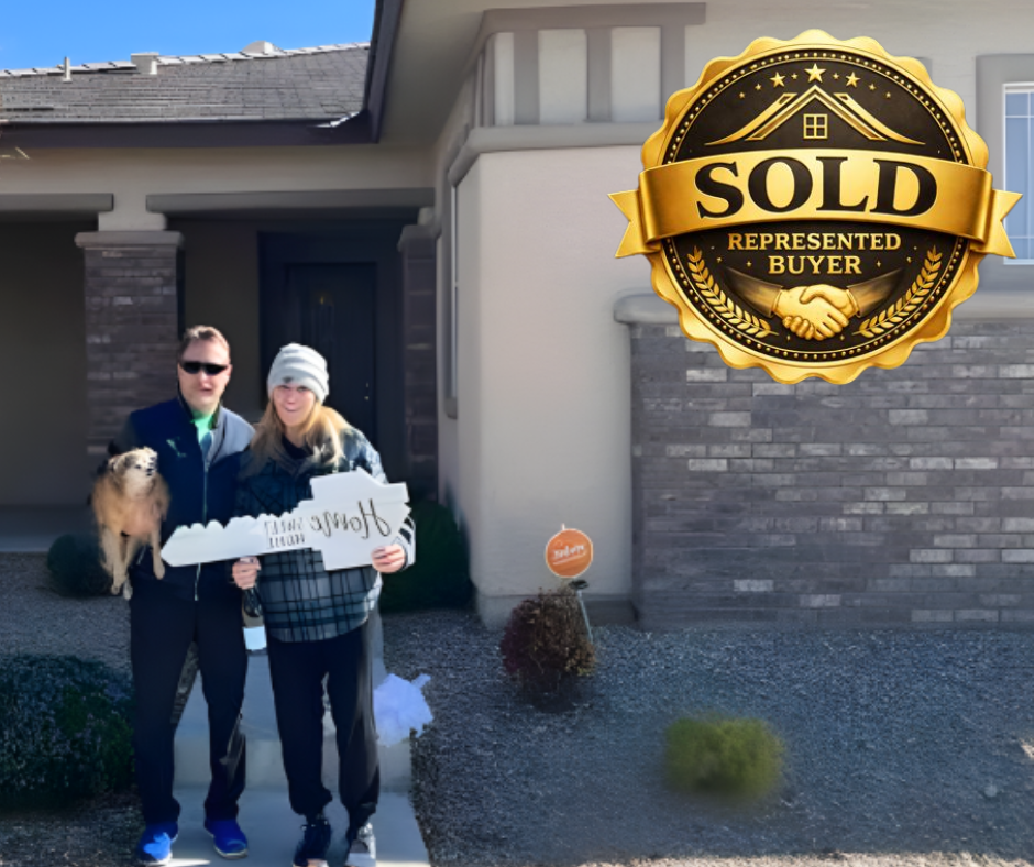 a man and woman standing in front of a sold sign