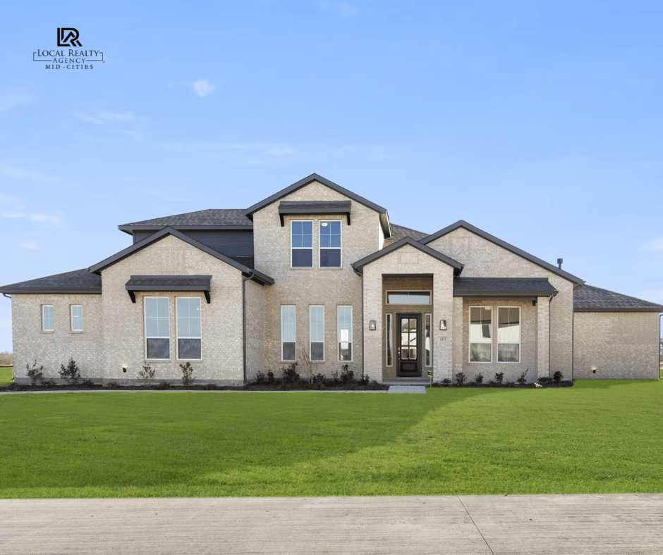 a large house with a large lawn and a driveway