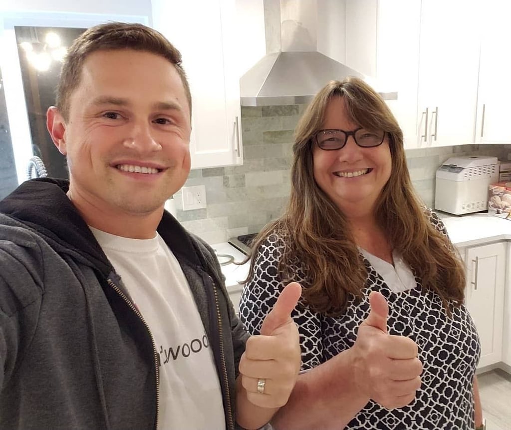 Water damage home restoration. Kitchen remodel featuring custom stained hardwood floors in Mill Creek