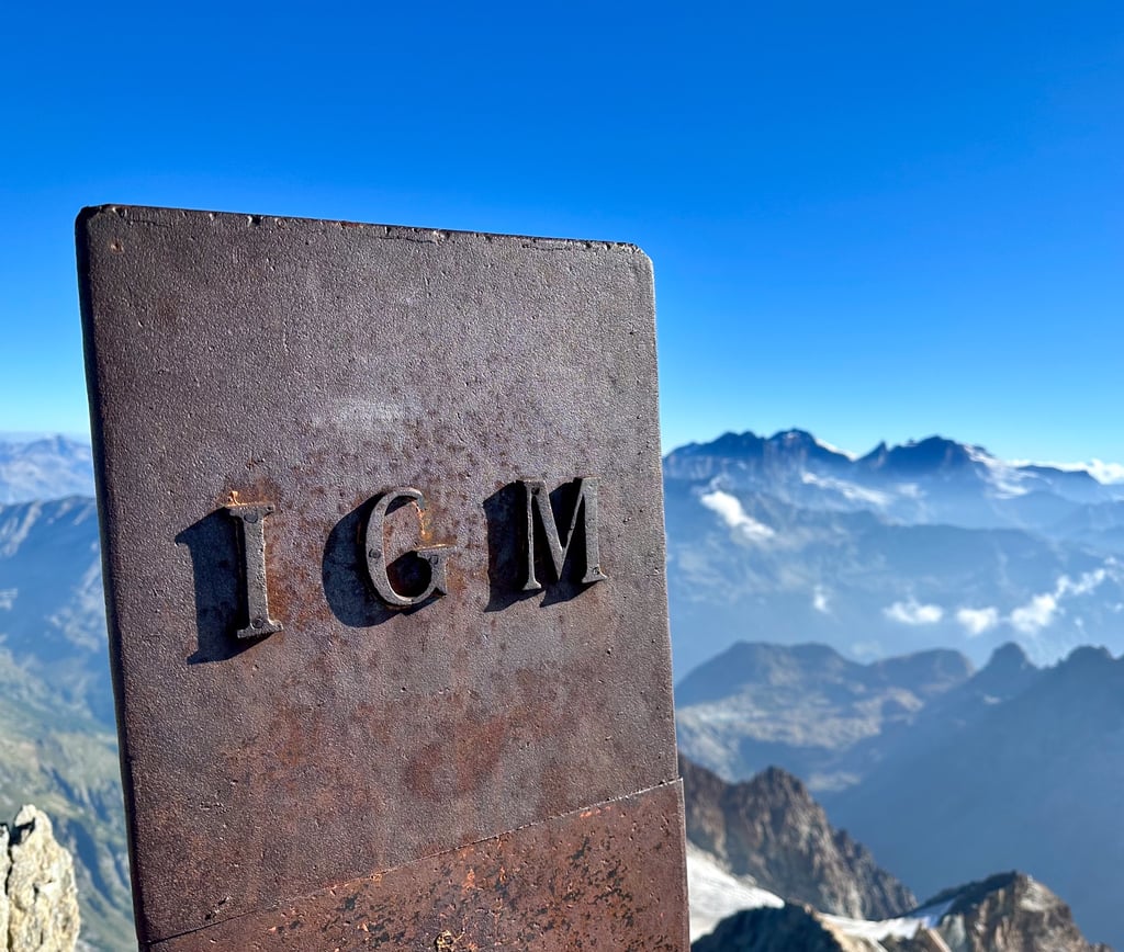 On the summit of Monte Disgrazia, with Piz Bernina in the background. Valmasino - Italy